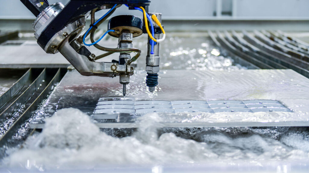 CNC water jet cutting a steel plate