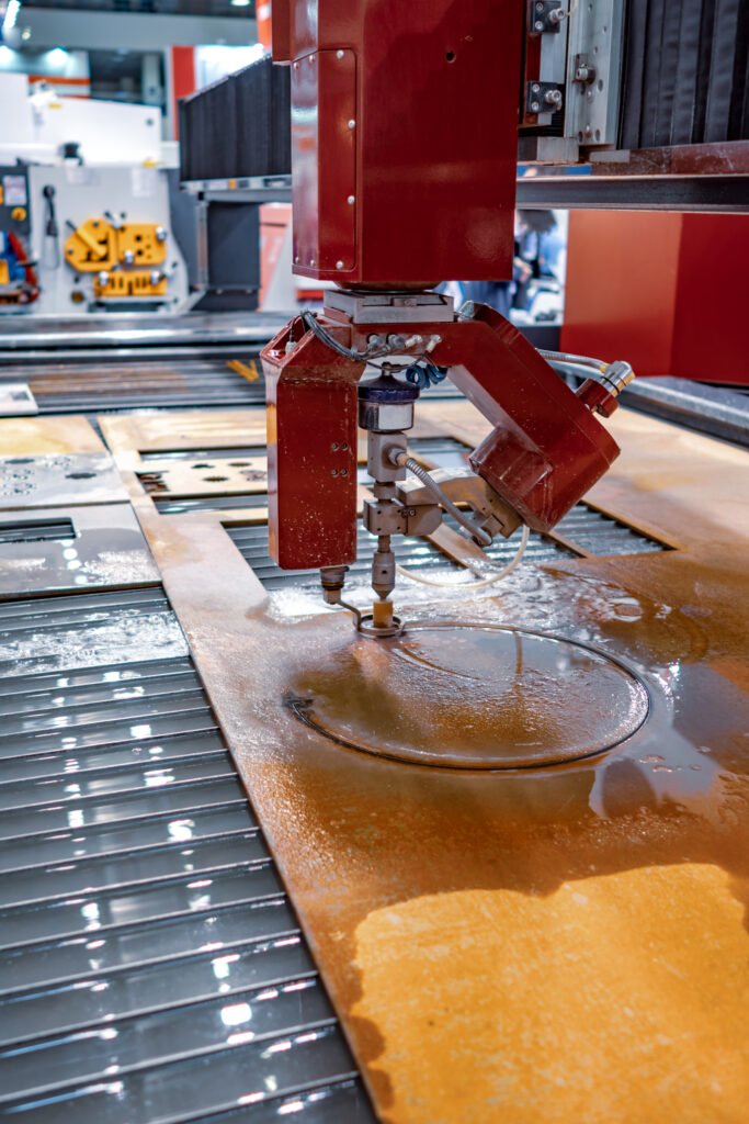 Industrial waterjet cutting machine cutting metal sheets