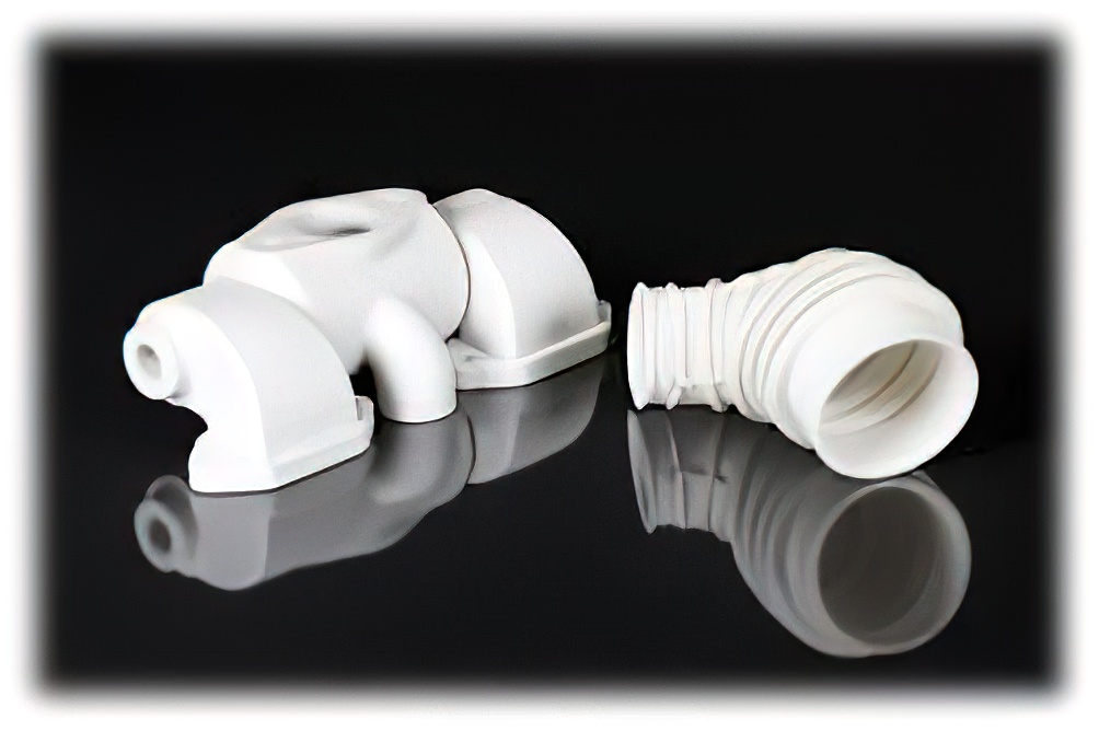 Two 3D-printed industrial components with smooth finishes