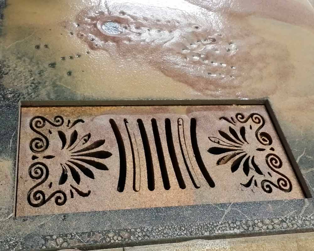 Waterjet-cut tile floor vent cover