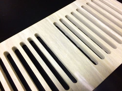 Waterjet-cut tile floor vent cover